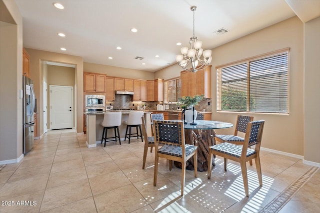 12820 W La Vina Dr, Sun City West, AZ 85375 - dining space with visible vents, recessed lighting, a notable chandelier, and light tile patterned flooring