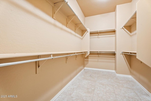 12820 W La Vina Dr, Sun City West, AZ 85375 - spacious closet with tile patterned flooring