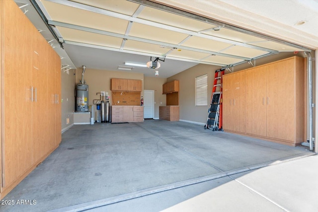 12820 W La Vina Dr, Sun City West, AZ 85375 - garage with secured water heater, baseboards, and a garage door opener