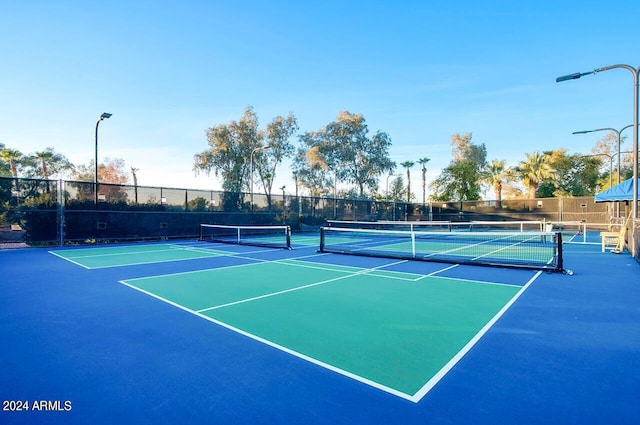 12820 W La Vina Dr, Sun City West, AZ 85375 - view of tennis court with fence and community basketball court