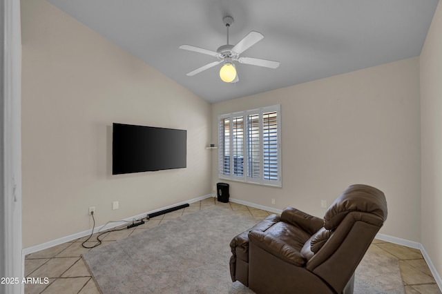 sitting room featuring light tile patterned floors, vaulted ceiling, and ceiling fan