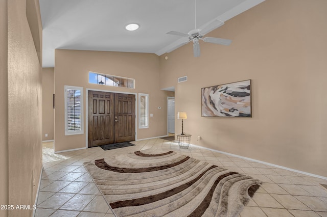 entryway featuring ceiling fan and vaulted ceiling