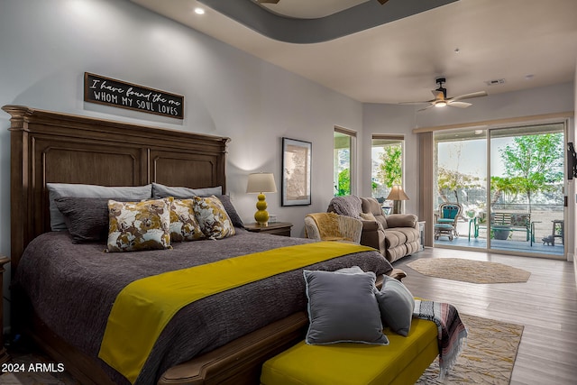 bedroom with access to outside, ceiling fan, and light wood-type flooring