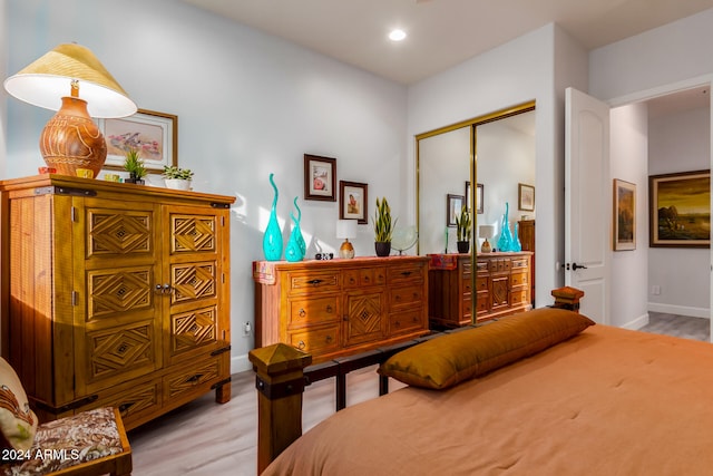 bedroom featuring a closet and light hardwood / wood-style flooring