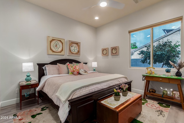 bedroom featuring light wood-type flooring and ceiling fan