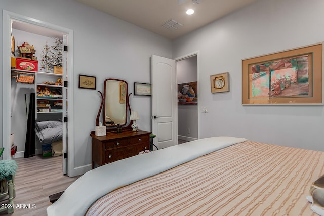 bedroom with light hardwood / wood-style floors