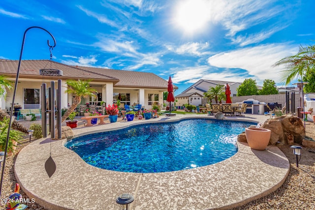 view of swimming pool featuring a patio area