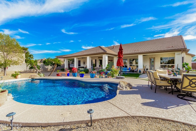 view of swimming pool with a patio