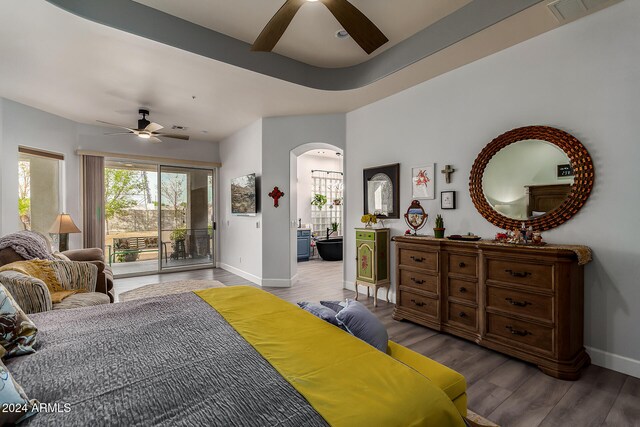 bedroom featuring hardwood / wood-style floors, access to outside, and ceiling fan