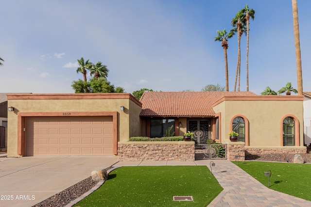 mediterranean / spanish-style house featuring stucco siding, an attached garage, a tile roof, and driveway