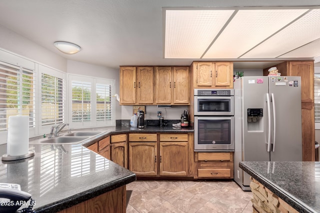 kitchen with stainless steel appliances and a sink