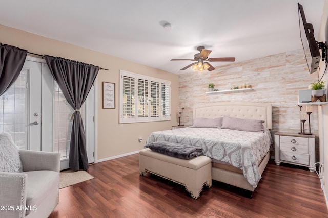 bedroom with ceiling fan, baseboards, and dark wood-style flooring