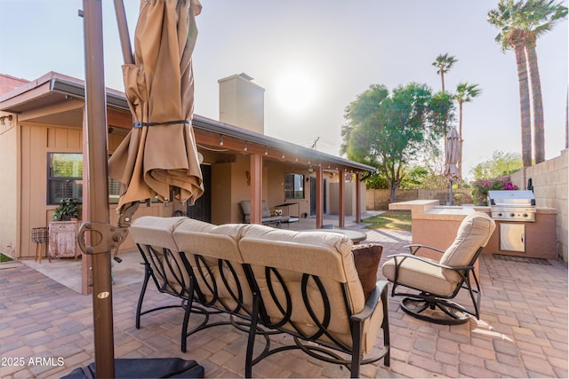 view of patio with a grill, a fenced backyard, and an outdoor hangout area