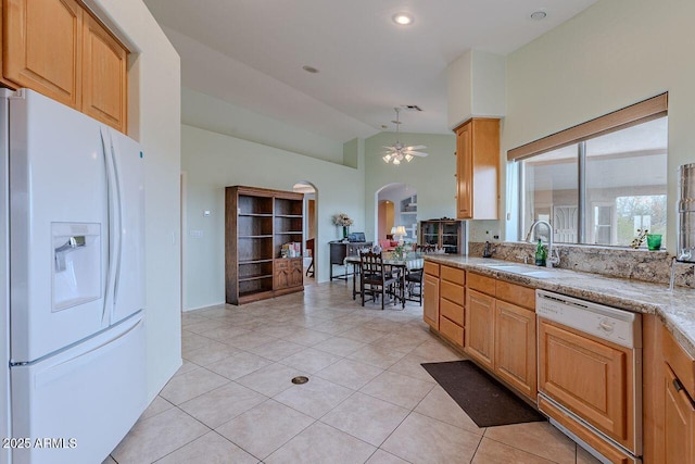 16507 E Trevino Dr, Fountain Hills, AZ 85268 - kitchen featuring a sink, a ceiling fan, white refrigerator with ice dispenser, arched walkways, and paneled dishwasher