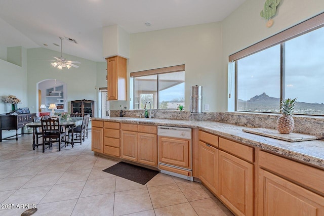 16507 E Trevino Dr, Fountain Hills, AZ 85268 - kitchen featuring light tile patterned floors, light brown cabinetry, a sink, paneled dishwasher, and a ceiling fan