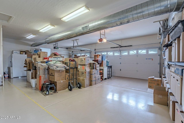 16507 E Trevino Dr, Fountain Hills, AZ 85268 - garage featuring visible vents and a garage door opener