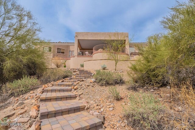 16507 E Trevino Dr, Fountain Hills, AZ 85268 - view of front of home featuring a balcony, stucco siding, and stairway