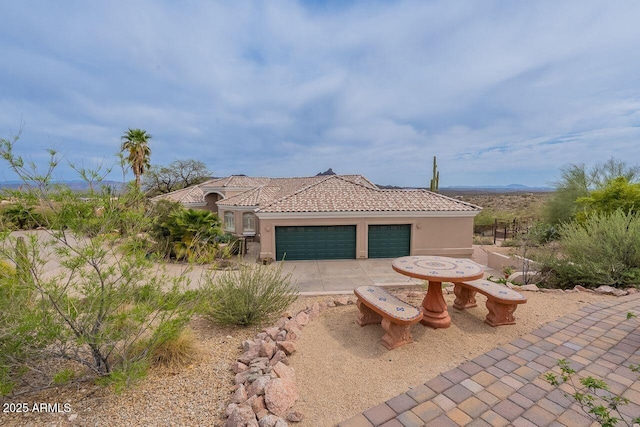 16507 E Trevino Dr, Fountain Hills, AZ 85268 - mediterranean / spanish-style home with stucco siding, driveway, a garage, and a tile roof