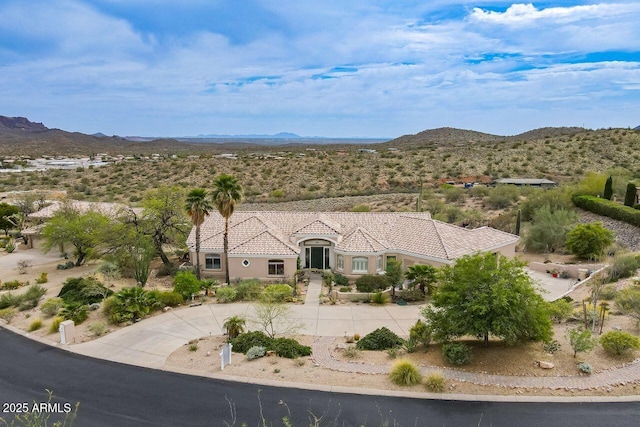 16507 E Trevino Dr, Fountain Hills, AZ 85268 - view of front facade featuring stucco siding, a tiled roof, a mountain view, and curved driveway