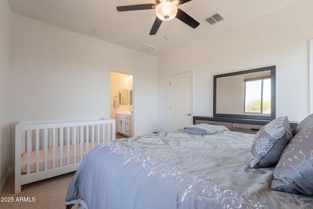carpeted bedroom featuring visible vents