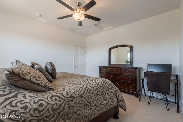bedroom with attic access, ceiling fan, and light carpet