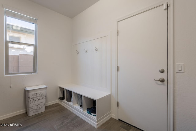 mudroom featuring baseboards and wood finished floors