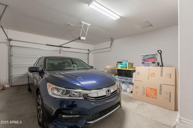 garage featuring a garage door opener