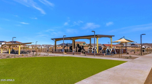 view of home's community with a yard, playground community, and a residential view