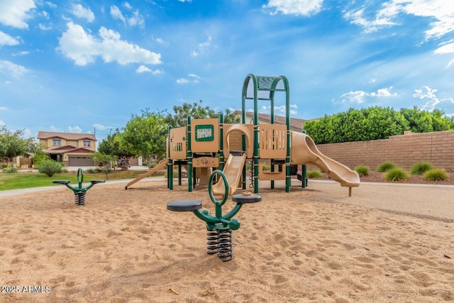 communal playground featuring fence