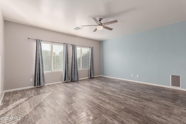 empty room with ceiling fan and wood-type flooring