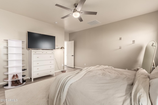 bedroom with wood-type flooring and ceiling fan