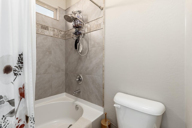 bathroom with shower / bath combo with shower curtain and toilet