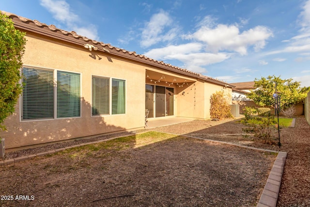 rear view of property featuring a patio area