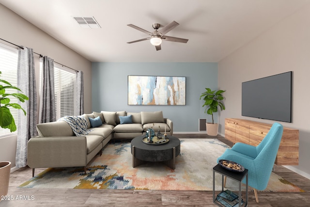 living room featuring hardwood / wood-style floors and ceiling fan