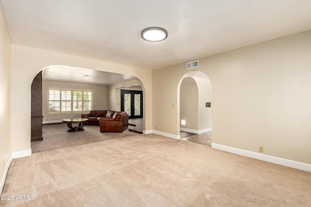 119 E Palomino Dr, Tempe, AZ 85284 - living area with arched walkways and light carpet