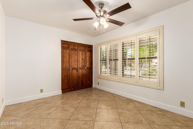 119 E Palomino Dr, Tempe, AZ 85284 - unfurnished bedroom featuring light tile patterned floors, a closet, and ceiling fan