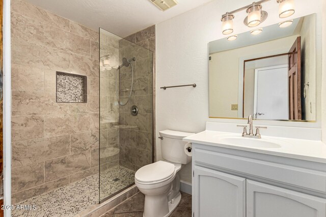 119 E Palomino Dr, Tempe, AZ 85284 - bathroom featuring vanity, tiled shower, and tile patterned flooring