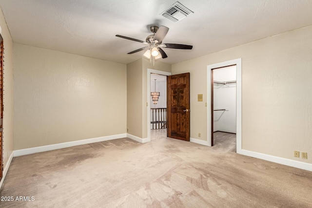 119 E Palomino Dr, Tempe, AZ 85284 - unfurnished bedroom with light colored carpet, a spacious closet, a ceiling fan, and a closet