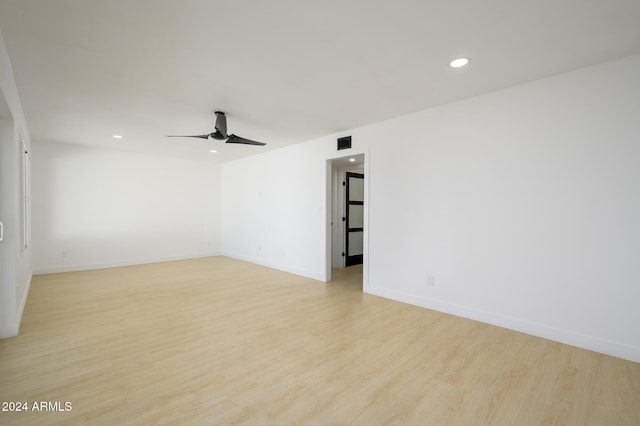 unfurnished room with light hardwood / wood-style flooring and ceiling fan