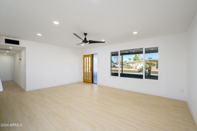 unfurnished room featuring ceiling fan and light hardwood / wood-style floors
