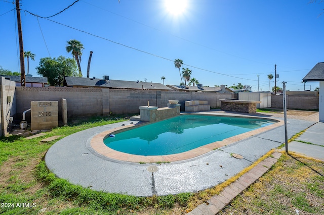 view of swimming pool with a storage shed