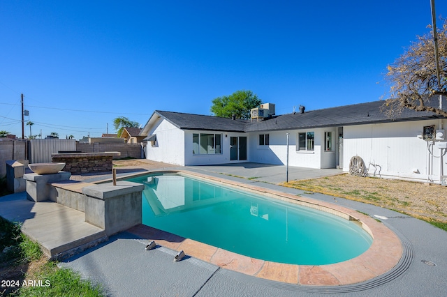 view of swimming pool featuring a patio