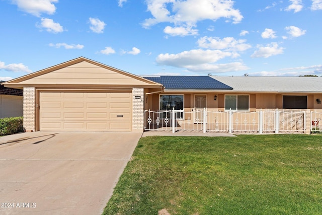 ranch-style home with a front yard and a garage