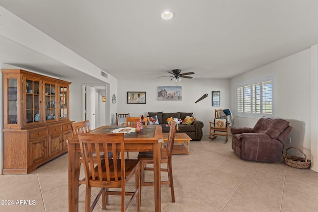 dining room with ceiling fan and light tile floors