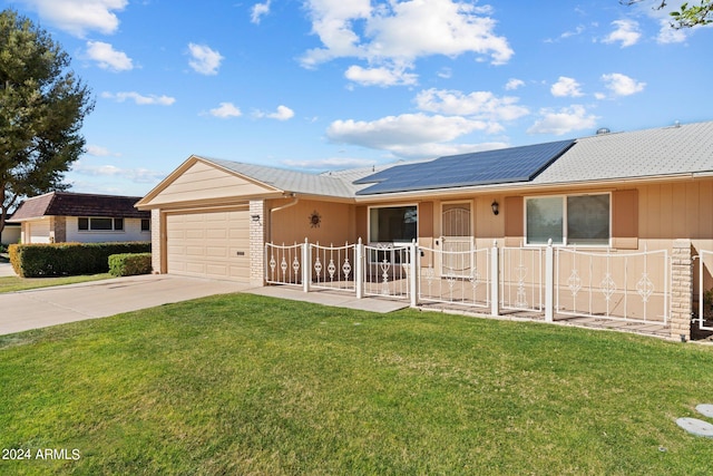 single story home featuring solar panels, a front lawn, and a garage