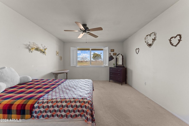 bedroom with light carpet and ceiling fan