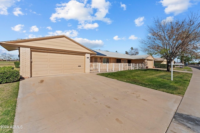 single story home with a front lawn and a garage