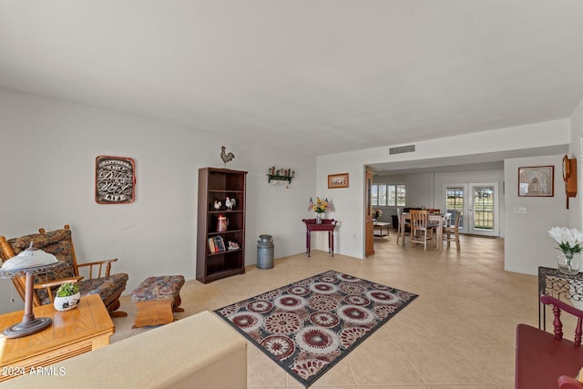 living room featuring light tile floors