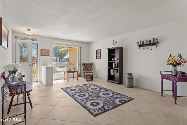 sitting room featuring light tile floors