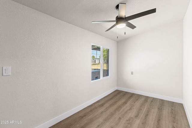 4048 W Granada Rd, Phoenix, AZ 85035 - empty room with light wood-style floors and ceiling fan